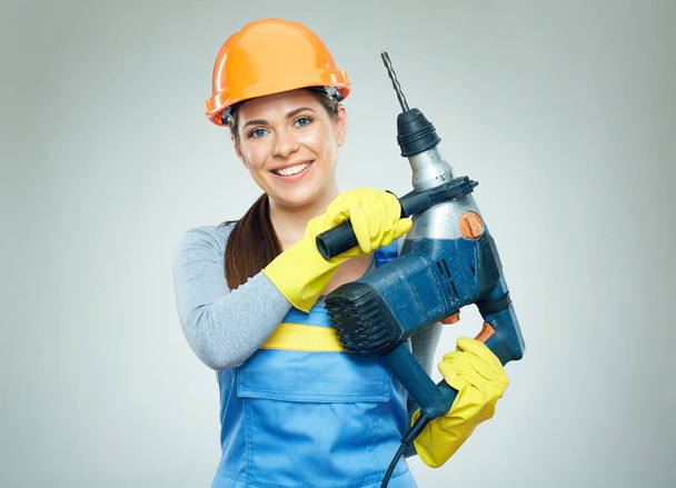 Woman builder holding drill tool.  - Photo, Image