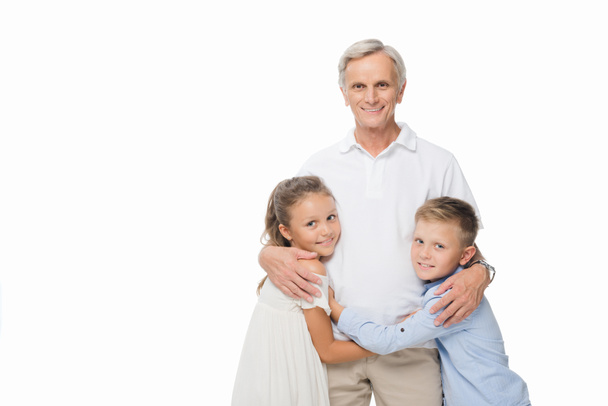 grandfather and grandchildren hugging together - Photo, Image