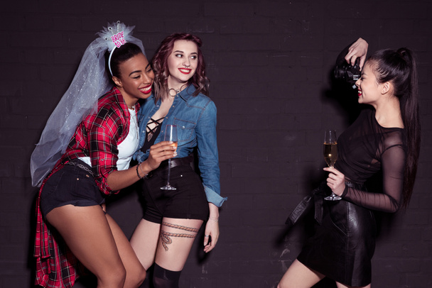 multicultural women photographing at hen party - 写真・画像
