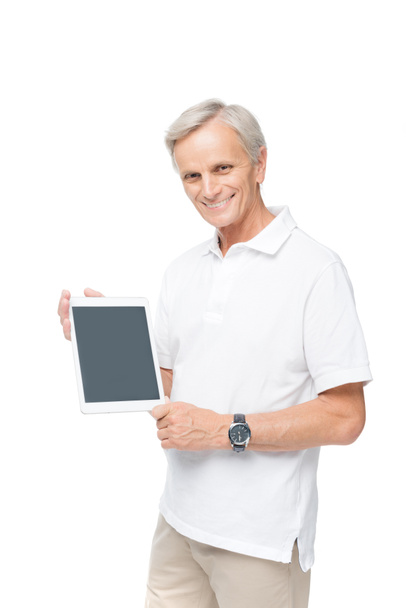 senior man with digital tablet  - Фото, изображение
