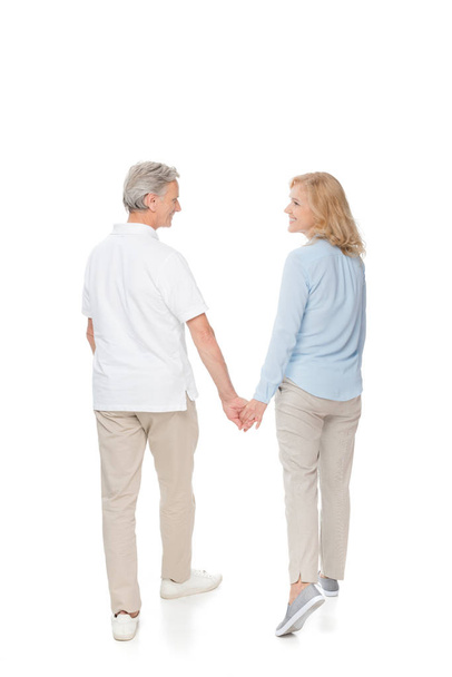 mature couple holding hands - Фото, изображение