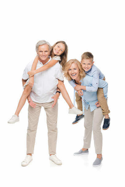 kids piggybacking on grandparents - Photo, image