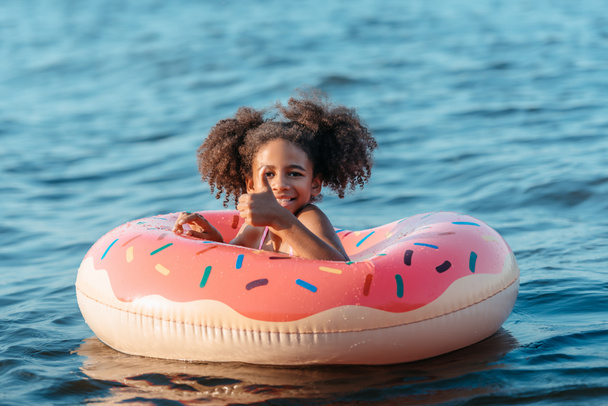african american child with swimming ring - Photo, Image