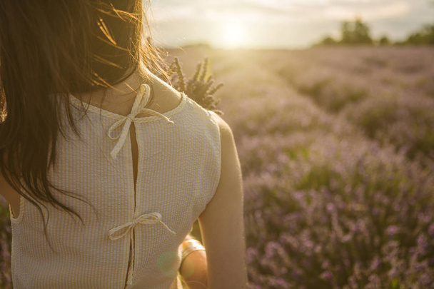 Adorable lavender field mood unrecognizable portrait of young tender woman. - Photo, Image