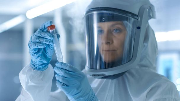 Medical Virology Research Scientist Works in a Hazmat Suit with  - Valokuva, kuva