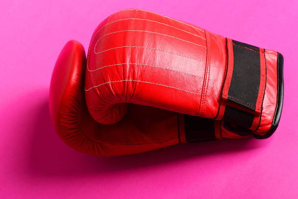 Bright red boxing sport gloves with stripes isolated on pink - Fotoğraf, Görsel