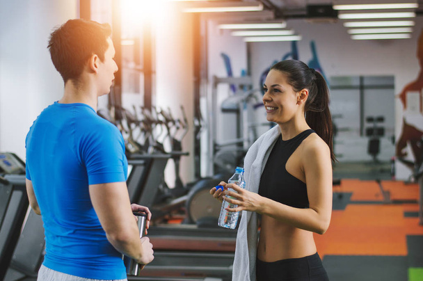 Woman talking to fitness trainer   - Photo, Image