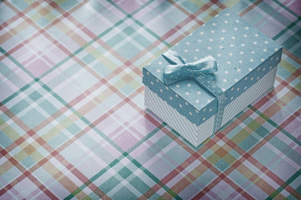 Present box on checked fabric celebrations concept - Photo, Image