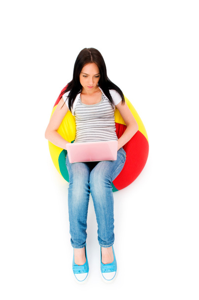 Girl working on laptop isolated on white - Photo, Image
