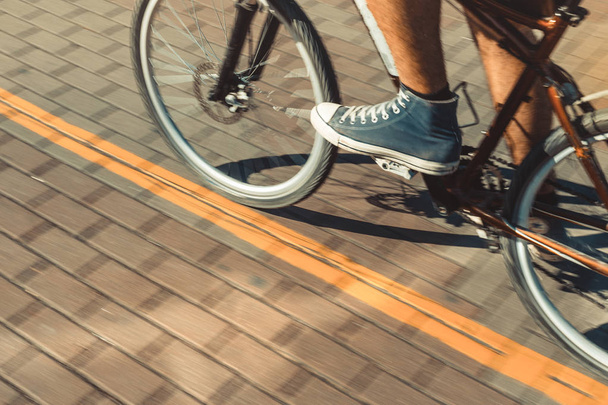 Unrecognizable Cyclist Rides A Bicycle Path Motion Blur. Point Of View Shot - Photo, image