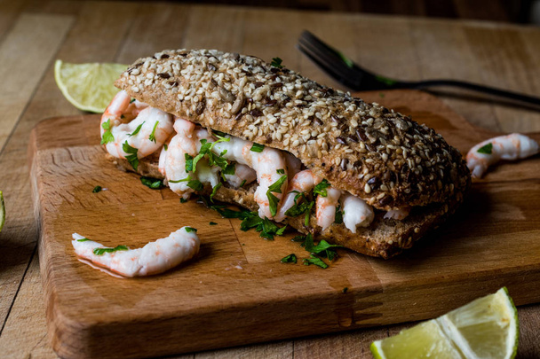 Shrimp Sandwich with lime on wooden surface. - Fotó, kép