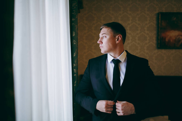 Portrait of the groom on a wedding day walk - Photo, Image