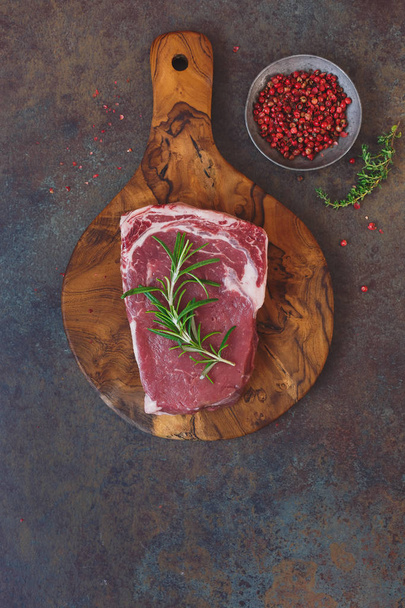 Raw angus  beef steak on a cutting board  - 写真・画像