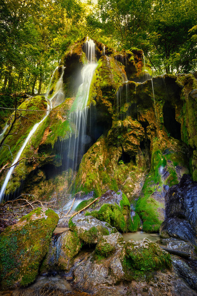 Waterfall with mossy boulders - Фото, изображение
