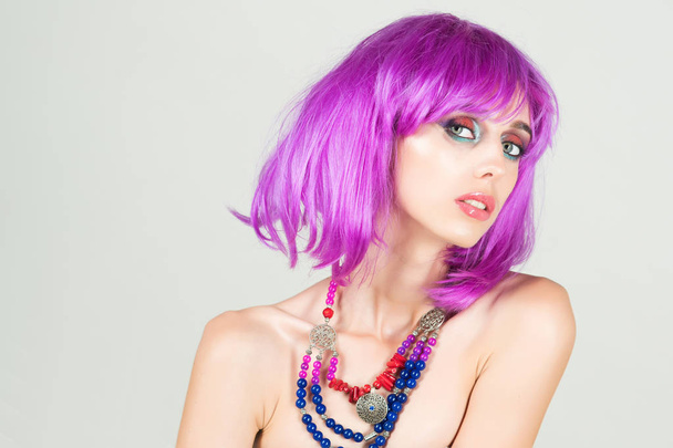 Woman in violet wig with fashionable makeup. - Fotoğraf, Görsel