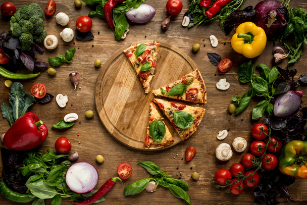 pizza slices on wooden board - Photo, Image