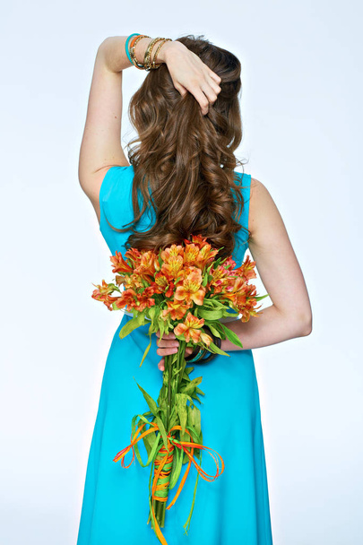 woman holding bouquet of beautiful flowers - Фото, зображення