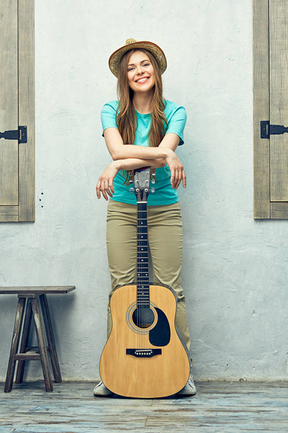 Positive woman with guitar  - Foto, Bild