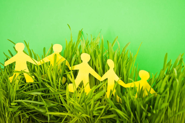 Paper people on grass - Photo, Image