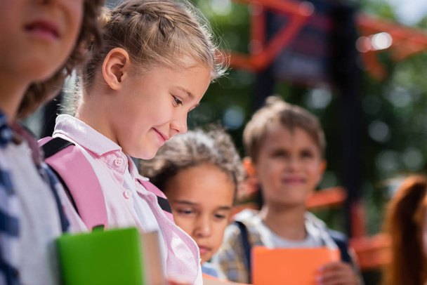 kids with books on playground - Fotografie, Obrázek