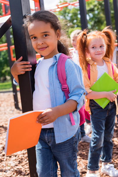 multiethnic kids with books on playground - Zdjęcie, obraz