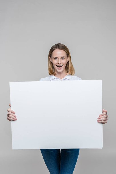 woman with blank board - Foto, Imagen