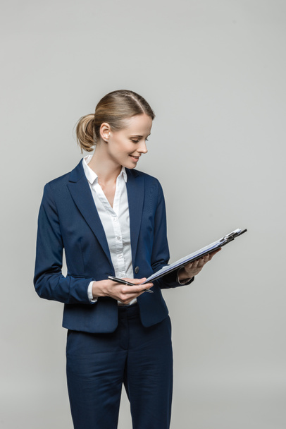 businesswoman with clipboard and documents - Foto, imagen