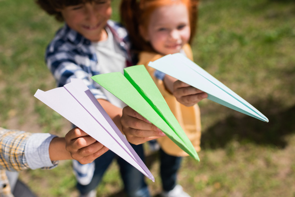 kids playing with paper planes - 写真・画像