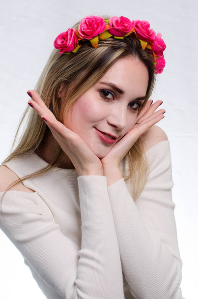 beautiful girl in a floral headband - Фото, изображение