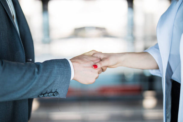 Close-up of shaking hands after a business meeting in the office - Фото, зображення