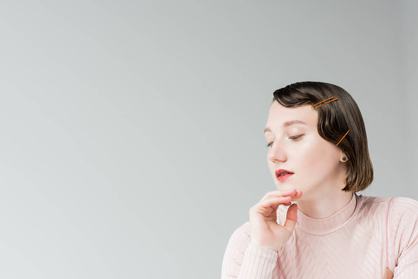 pensive woman with retro hairstyle - 写真・画像
