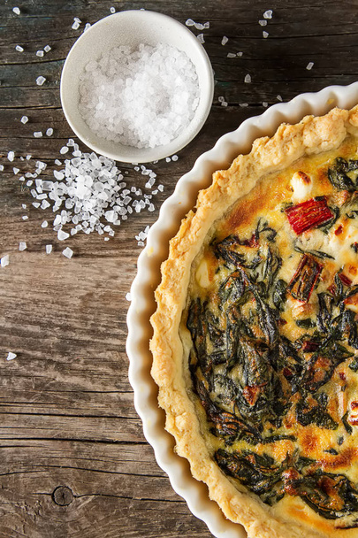 Homemade cheese Quiche egg for brunch with spinach and chard - Fotó, kép