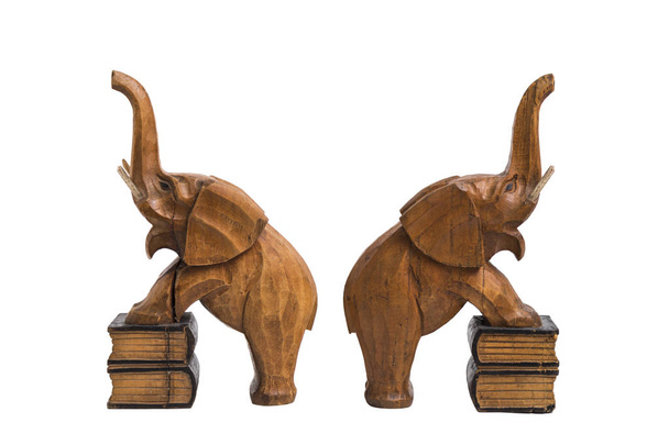 Two vintage old wooden carved brown elephants holders with raised trunks - Foto, imagen