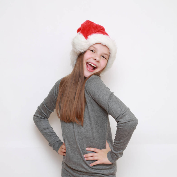 little girl in santa hat - Fotografie, Obrázek
