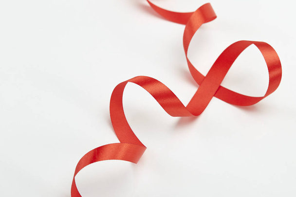 Red curly ribbon isolated on white - Foto, Imagem