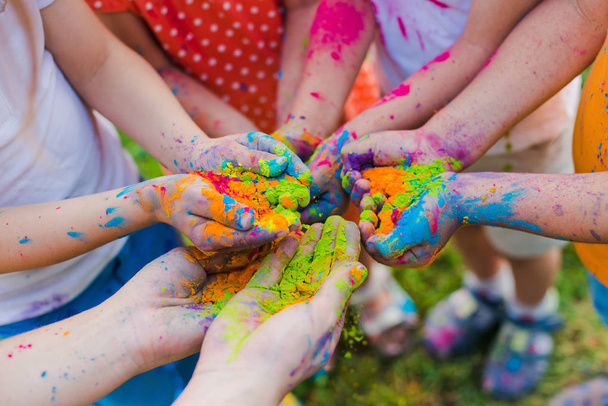 Paint holi on the hands of children - Photo, Image