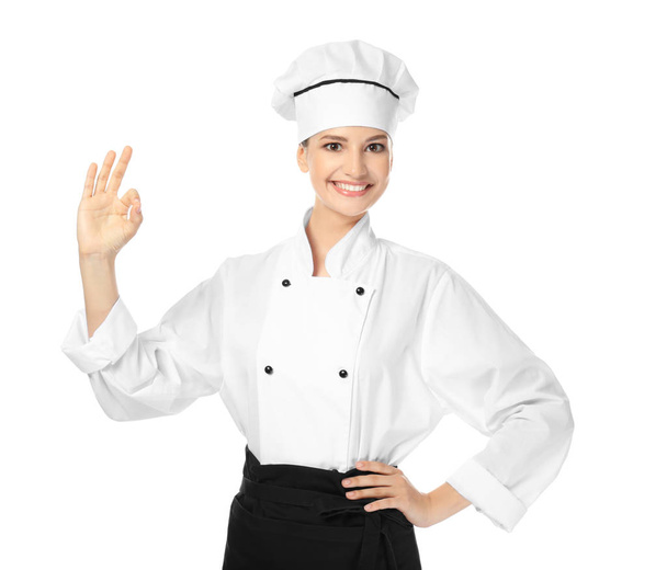 Young female chef on white background - Valokuva, kuva