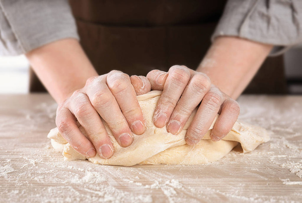 Woman kneading dough  - Photo, image