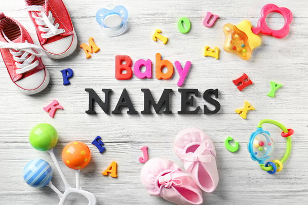 Composition with text BABY NAMES on wooden background - Fotografie, Obrázek