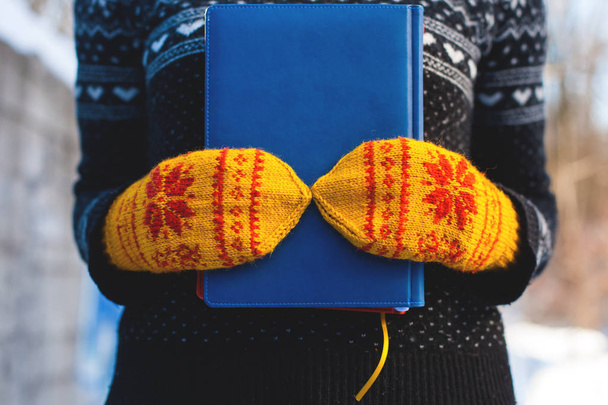 Books on the background of knitted sweaters. - Photo, Image
