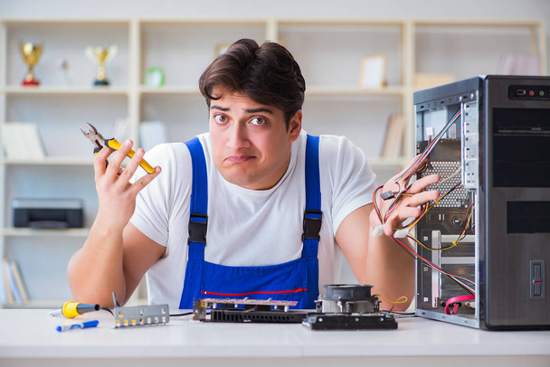 Computer repairman repairing desktop computer - Photo, Image