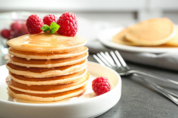 Plate with delicious pancakes on table - Foto, Imagen