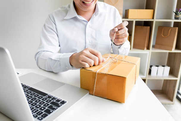 Business owner man working online shopping prepare product - 写真・画像
