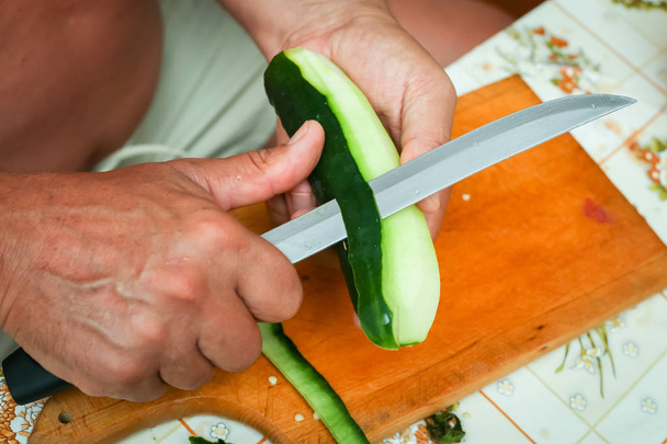 Preparing cucumber on board - Photo, Image