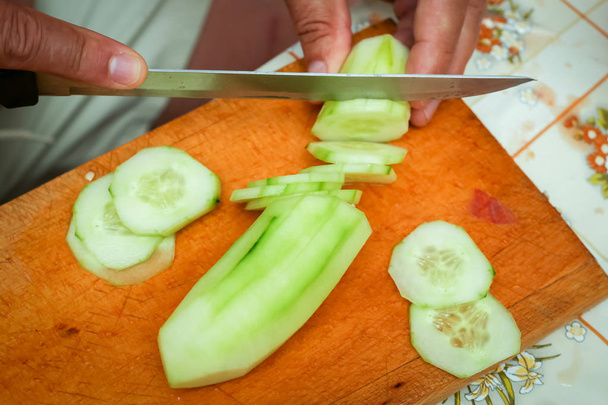 Preparing cucumber on board - Photo, Image