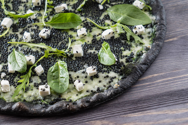 pizza with black caviar - Foto, afbeelding