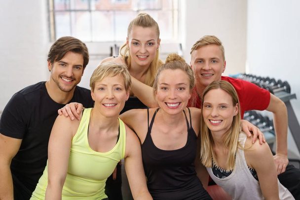 Group of cheerful people at gym - Fotó, kép