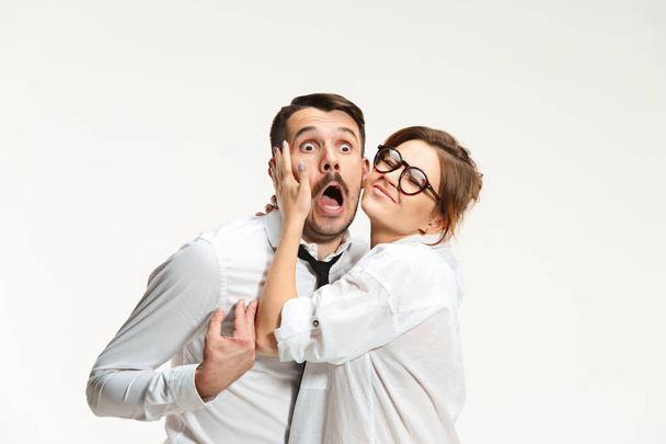 The business man and woman communicating on a gray background - Photo, image