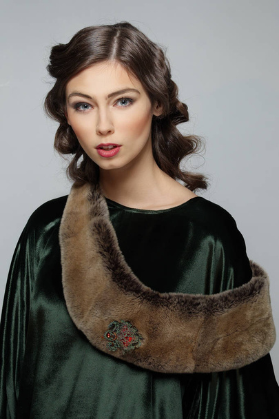 Pretty fashion model in dress with fur . Curly hairstyle. - Fotoğraf, Görsel