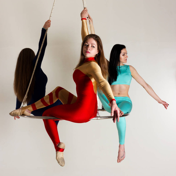 Woman`s trio on aerial luster - Foto, Bild